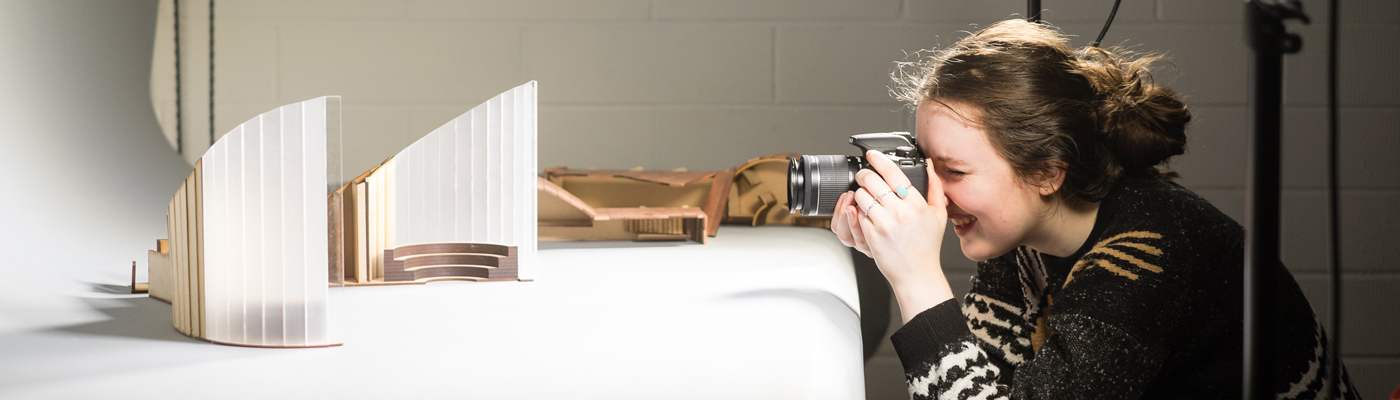 Architecture student photographing model