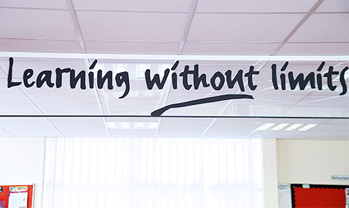 Sign in a building lobby which says 'Learning without Limits'