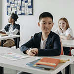 Three chikldren in a classroom