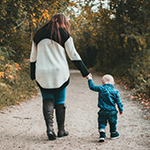 Mother and child walking on a path