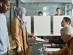 people voting in a polling station