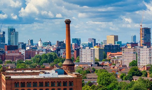 View of city buildings and chimney tower