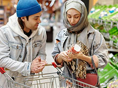 A coulpe shopping in a supermarket