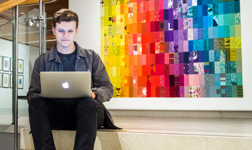 Education student using laptop.