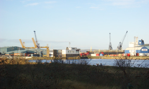 Photograph of an industrial port depicting transatlantic travels.