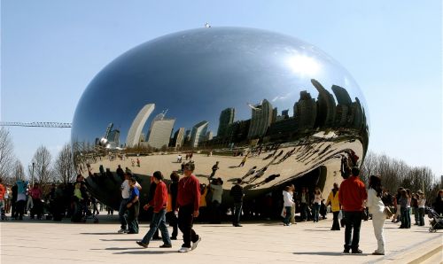 People walking past an urban design tourist attraction.