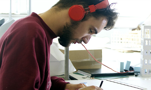 Male student studying at desk
